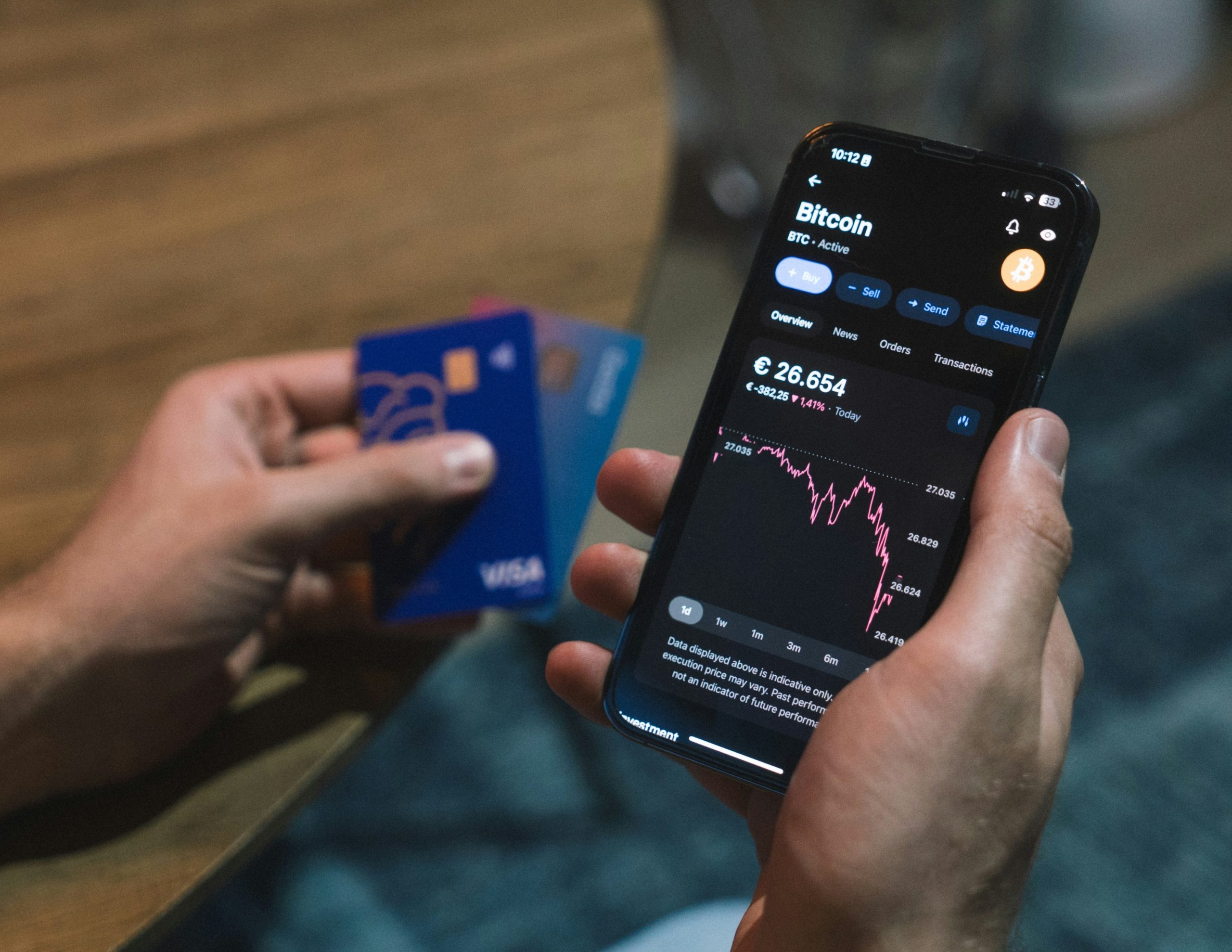 Person analyzing finances on mobile phone